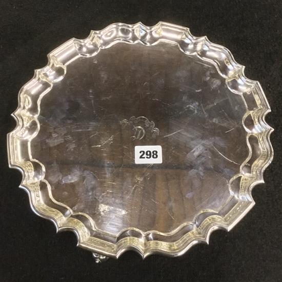 Silver salver with piecrust edge on 3 scrolled feet, initialled, Goldsmiths & Silversmiths Co.